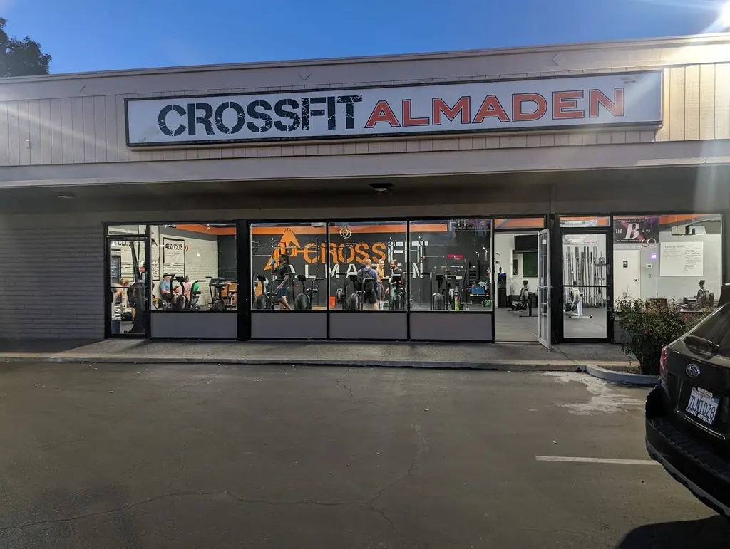 The glass frontage of CrossFit Almaden on Blossom Hill Road with members training inside
